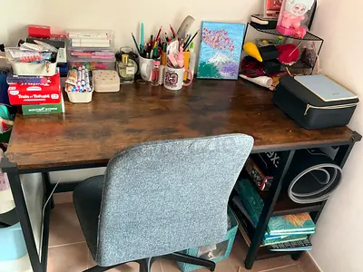 Wooden study desk with metal shelving and swivel chair - used