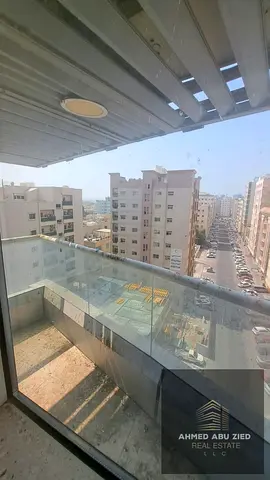 2 Bedroom Apartment with Living Room and Balcony for Rent in Al Nuaimiya Ajman Near Kuwait Street with Pool Gym Parking and Central Gas