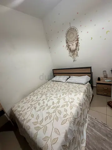 Queen bed frame with mattress and bedside drawer -good condition with prime mattress and dressing