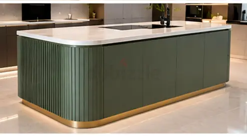 Modern green kitchen island with marble top and brass base