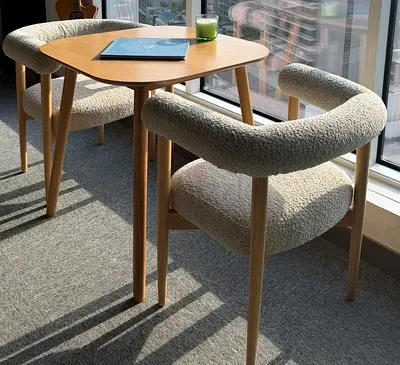 Pair of modern boucle dining chairs with oak frame