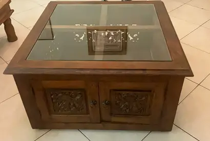 Carved Wood Coffee Table with Glass Top and Storage