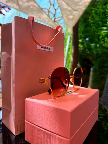 Miu Miu Women's Sunglasses with Case and Bag