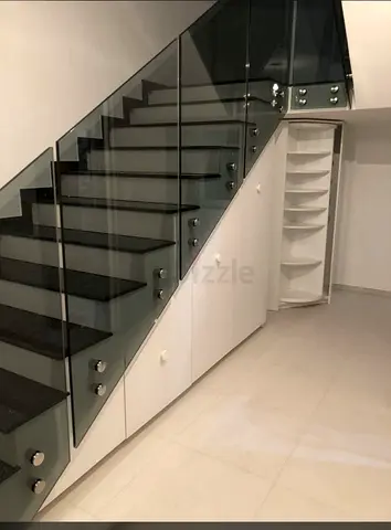 Under-stair Storage Cabinets with Curved Shelves — White Built-in Unit