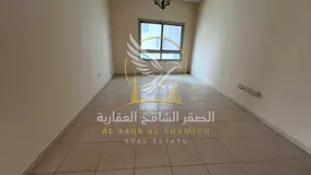 2BR in Um Tarafa, Spacious Layout, Master Bedroom, Balcony, Central AC & Best Price.