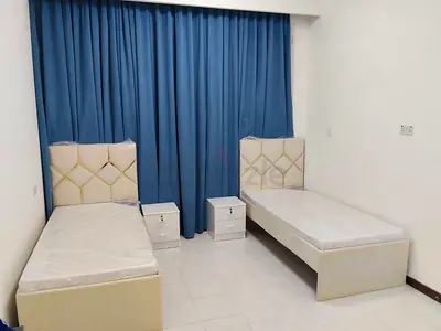 Two single beds with mattresses and bedside tables - almost new