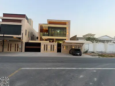 A luxurious European-style villa in Al Rawda 3, featuring two floors and a roof terrace. Located directly on Sheikh Ammar Street, the price includes e