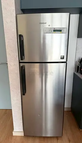 Whirlpool stainless steel top-freezer refrigerator - good condition