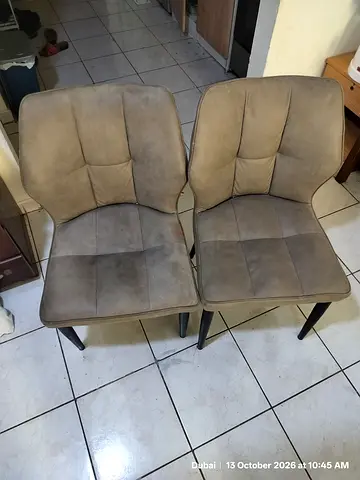 Pair of Beige Upholstered Dining Chairs with Black Legs