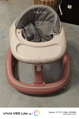 Lightly used pink baby walker with removable tray