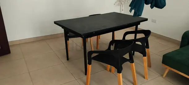Solid black dining table with 4 modern chairs - good condition