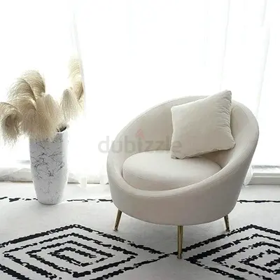 Cream round accent chair with gold legs