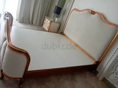 King sized vintage style bed frame with upholstered headboard and footboard