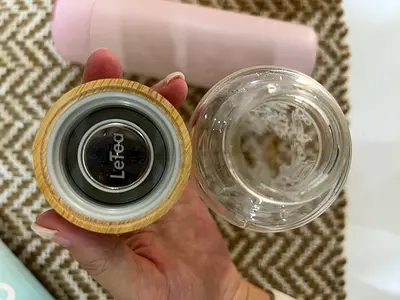 Glass water bottle with bamboo lid + pink insulated bottle — used