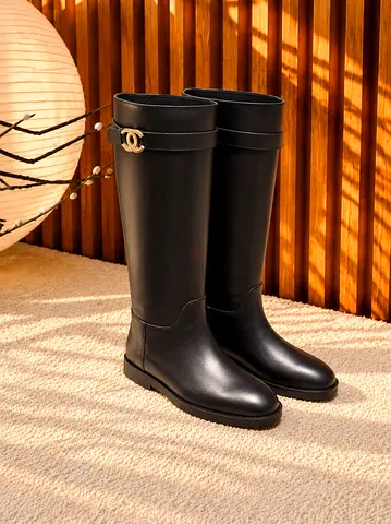 Black knee-high leather boots — classic tall women’s boots
