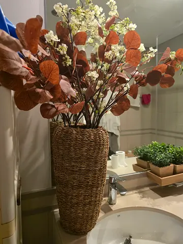 Wicker rattan vase with artificial flowers