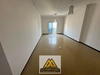 2BR in Al Nuaimiya 3, balcony, central AC, free parking. AED 46K negotiable, 4 payments, AED 5K cheque deposit.