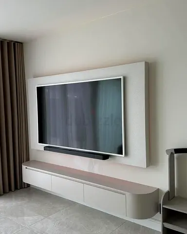 Modern wall-mounted TV entertainment unit with floating cabinet
