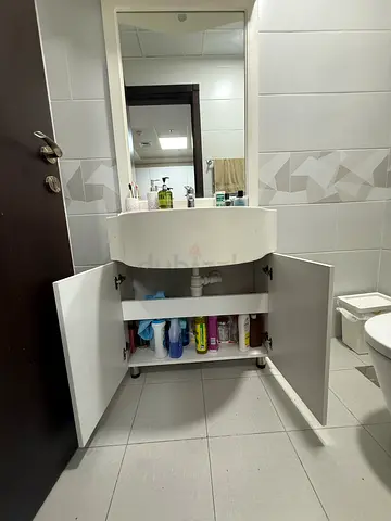 White bathroom vanity cabinet with sink and mirror - good condition