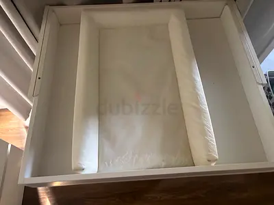 White changing table topper with padded changing mat