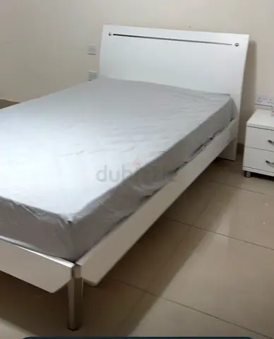 White double bed frame with headboard and mattress. 120cm and Side table — good condition