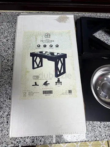Elevated wooden pet feeder with stainless bowls - gently used