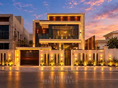 Luxury villa in Al Rawda 3, modern smart design, two floors, roof terrace, and garden, directly on Sheikh Ammar Street. Price includes electricity, wa