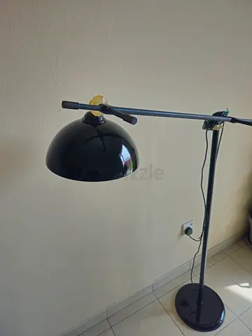 Black adjustable floor reading lamp with swivel arm