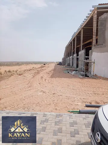 11,948 sq.ft investment land in UAQ, road access, ideal for warehouses & labour accommodation, 20 years.