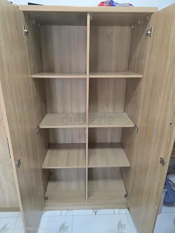 Two-door wooden wardrobe with multiple shelves - light oak finish