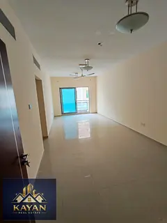For annual rent: a two-bedroom apartment with a living room in a prime location, opposite Umm Al Quw