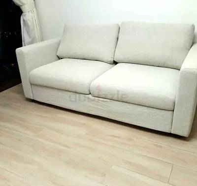 Light beige 2-seater fabric sofa bed in good condition vimle
