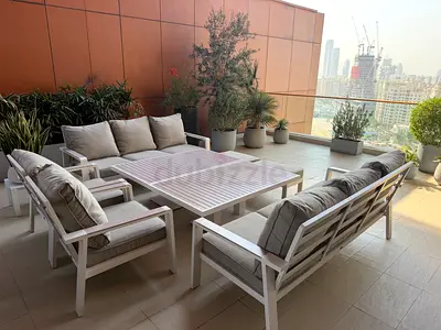 Gray outdoor sofa set with cushions and coffee tables - good condition