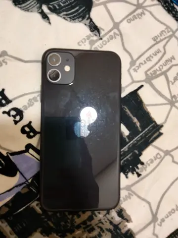 iPhone 11 64gb in Black - Good Condition, Unlocked have small shade dot and battery service