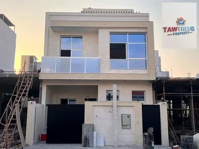 New townhouse villa for sale in Ajman at a special price of 1,200,000 AED, including water, electricity, and air conditioning.