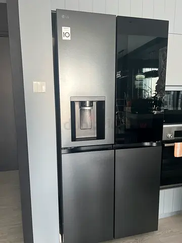 LG Black Stainless Steel Side-by-Side Refrigerator with Water Dispenser - Good Condition