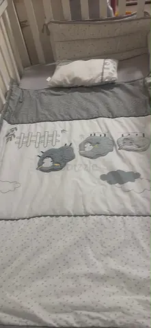 Baby crib bedding set with pillow and bumper - neutral grey penguin design