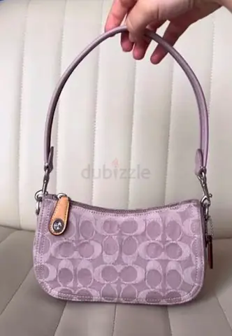 Coach Swinger 20 in Signature Denim, Pale Purple Color