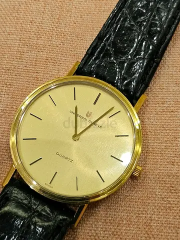 Universal Genève thin gold-tone quartz wristwatch with black leather strap