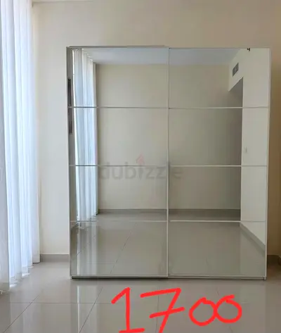White freestanding sliding door wardrobe. New original price 3700