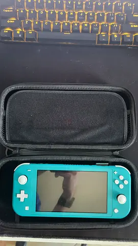 Nintendo Switch Light Turquoise Bundle + 3 games + Case