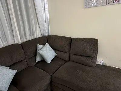 L-shaped dark brown fabric corner sofa - good condition