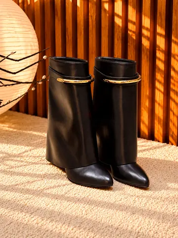 Black leather mid-calf heeled boots with gold trim