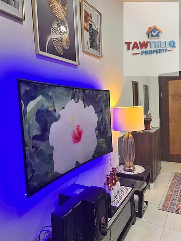 A fully furnished two-bedroom apartment with a living room is available for monthly rent in Al Rash