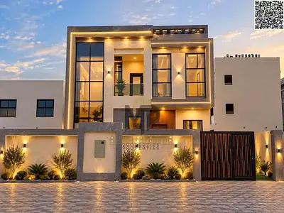 Luxury family villa for sale in Al Helio – Ajman, featuring a modern design, 4 master bedrooms, a m