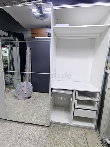 White built-in wardrobe with mirrored sliding door — good condition