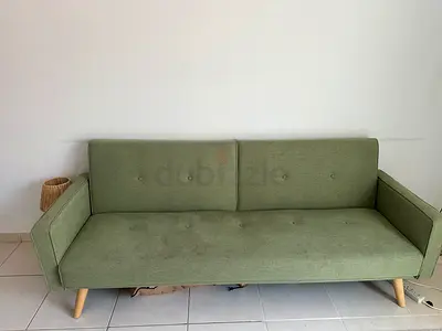 3-Seater Light green fabric sofa bed with wooden legs - good used condition - new price 1399