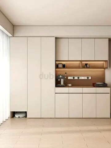 Built-in kitchen-style storage cabinets with integrated shelving and countertop