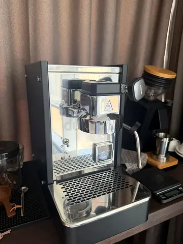 Compact stainless-steel espresso machine with steam wand - lightly used