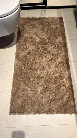Soft brown bathroom rug — gently used